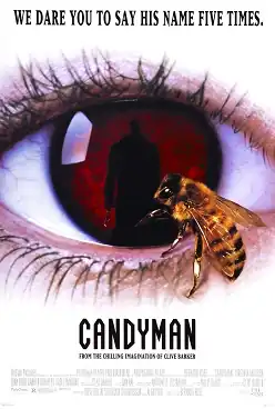 A shot of a eye of a person with a bee on it with the pupil in dark red with a shadow of a male figure in a coat with a hook. the title "CANDYMAN" appears below the eye along with the credits, the film's tagline reads. "We dare you to say his name five times."