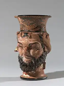 Etruscan vessel with a single handle, in the shape of a satyr's head, c.340 BC, ceramic, Petit Palais, Paris