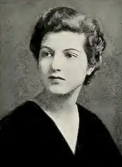 Woman with dark hair facing right