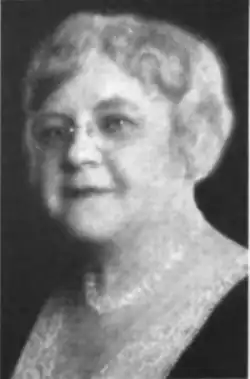 B&W portrait photo of a middle-aged woman