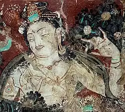 Detail of a Devata (right wall, top tier, left scene)