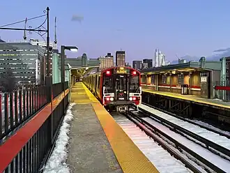 Red Line train entering Charles/MGH station in 2025