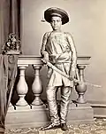 Portrait of the son of H.H. Chunnasee Rajoonath Pant (wearing churidars). 1860. Oriental and India Office Collection, British Library.