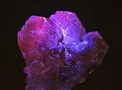 Rough alexandrite under UV light