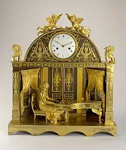 Clock; 1807–1810; fire-gilt bronze, blackened bronze, enameled metal (dial), blued steel (hands); glass; 56 x 49.7 x 18.5 cm; Cooper Hewitt, Smithsonian Design Museum (New York City)