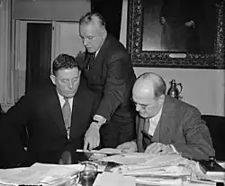 Harry Anslinger discussing cannabis control with Canadian narcotics chief Charles Henry Ludovic Sharman and Assistant Secretary of the Treasury Stephen B. Gibbons (1938)