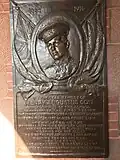 The bas relief plaque honors a student who died in World War I by Bela Pratt at St. Paul's School in Concord, NH