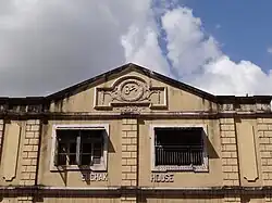 A colonial era building with the Om symbol (1930)