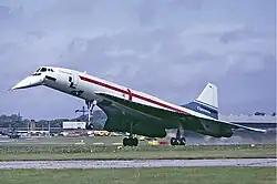 a BAC-liveried aircraft a few feet above a runway, with wheels down