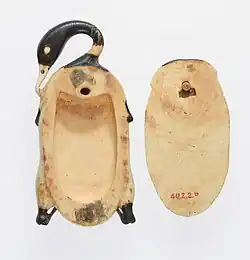 Cosmetic dish in the shape of a trussed duck; 1353–1327 BC; hippopotamus ivory (tinted); duck (left), length: 9.5 cm, width: 4.6 cm; cover (right), length: 7.3 cm, width: 4 cm; Metropolitan Museum of Art