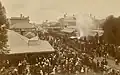 Crowds extended along the town's main thoroughfare, Murray Street; many people clambered on the locomotive and carriages