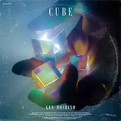 The digital single cover. In a stereo aesthetic, a lump hand holds onto three illuminative transluscent cubes. In the top left corner, text reads: "Stereo 3'25'"; at the bottom middle is Gen Hoshino's name in title case, above the copyright information.