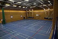 Sports hall, climbing wall, indoor cricket nets from viewing gallery