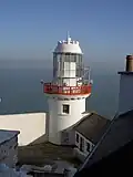 The active Wicklow Head Lighthouse was built in the 19th century, and operated by the Commissioners of Irish Lights.[6]