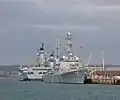 Mitscher at Portsmouth in October 2008 berthed with HMS Ark Royal and HMS Illustrious.