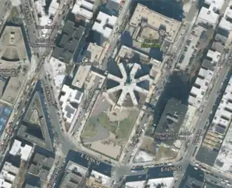 Aerial photograph of the Daughters of Jacob Home, showing the 8-spoked plan. Also visible is 167th Street, following a curved path in contrast to the otherwise rectangular street grid.