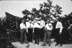 The state banner next to Governor Ed Jackson as he presents the deed of the first purchase of the Indiana Dunes State Park, 1925.
