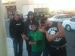 The band (with a fan in front in the green shirt)