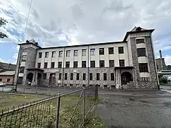 Stone façade of the historic school building, known as "Bastilia"