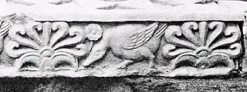 Right side frieze detail: geese and flame palmettes.