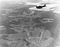 Douglas SBD-5 Dauntless over Hollandia airfield on 21 April 1944