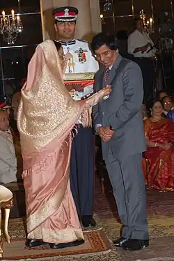Lal receiving the Padma Vibhushan Award from the President of India in 2009