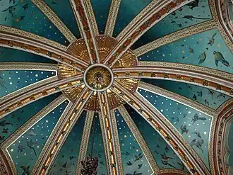 the room's vaulted ceiling