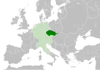 The Czech state in form of Duchy of Bohemia (green) in 11th century, within the Holy Roman Empire (light green).