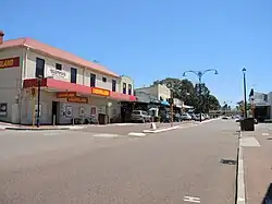Photograph of several buildings and parked cars in Bayswater's town centre