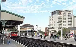 The platforms at East Putney station in September 2006, with a southbound District line train arriving on the left.