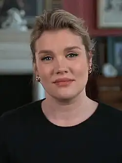 Emereld Fennell reading from a book in 2013.