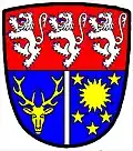 an endorse—Per fess gules and azure; in chief three lions rampant, argent, in base an endorse argent between, dexter, a stag's head cabossed, and, sinister, a sun in its splendour, between five mullets, or—Ross and Cromarty District Council, `Scotland