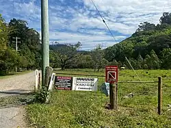 Entry sign for the Karu-Kali Community in Main Arm as pictured in September 2024