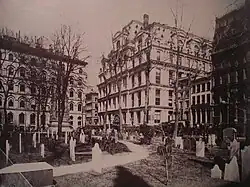 Photograph looking northeast from Trinity churchyard across Broadway, at the Equitable Life Assurance Building in 1870
