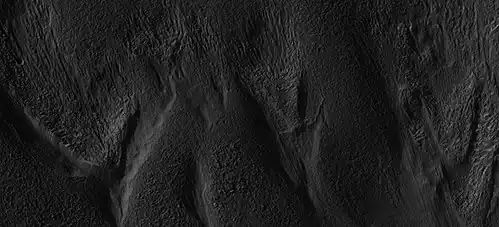 Close-up of small glaciers from a previous image, as seen by HiRISE under the HiWish program. Some of these glaciers seem to be just starting to form.