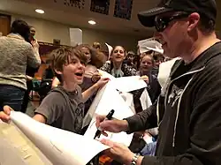 Étienne signing autographs for his fans in Ottawa, Ontario, Canada in 2018.