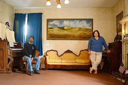 Evan Curtis Charles Hall, House Museum, and Amy Rowland, La Puente Valley Historical Society, in the John Rowland Mansion Parlor, April 2024