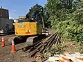 Excavator with rail removed from Watertown Branch for Phase II path construction, Sept. 2018