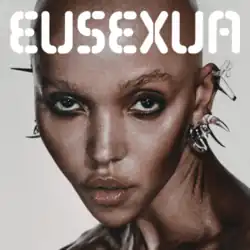 The word "EUSEXUA" above a bald Twigs, who looks into the camera with neck craned and ears extensively ornamented