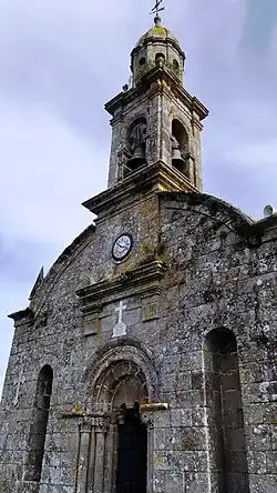 Details of the facade of the church of San Salvador de Escuadro and campanile.
