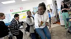 Gayflor teaching students at the Folk Arts-Cultural Treasures Charter School in 2009
