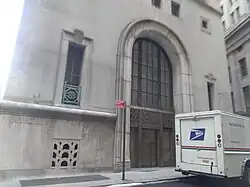 The entrance at the corner of Exchange and William Streets, which is a large stone archway