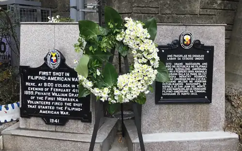 Historical markers on the site of the first shot of the Philippine-American War.