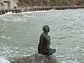For the Folkestone Triennial (art show) in 2011, Cornelia Parker made a bronze statue of a mermaid – a life cast of resident Georgina Baker. Wear Bay Road is behind.