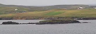 View of the islet from Sandness with Papa Stour in the background