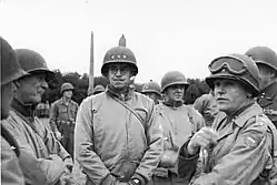General officers including Omar Bradley and Gen. J. Lawton Collins (with goggles) attending Roosevelt's funeral. General Clarence Heubner is visible behind Bradley, and George Patton is partially visible behind Collins.