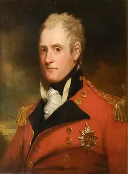 Painting shows an man in a red military uniform with black breeches standing next to a white horse.
