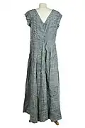 Grey pleated dress designed by Sybil Connolly.
