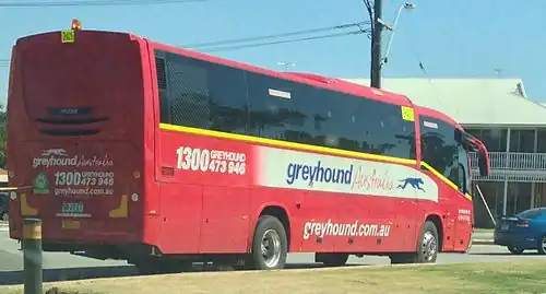 Irizar Century bodied Mercedes-Benz OH1830 in Perth in October 2013 with fluorescent yellow stripe and hazard light for operation on mining sites