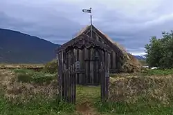 The Gröf church. Photo taken in front of the bell gate with the church behind. A mountain looms in the background